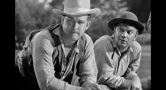 Guinn William as Vulch McCreedy and Cliff Edwards as Buzz McCready, getting ideas about the tax money Jeff Burton is collecting in The Bad Man of Brimstone (1937)