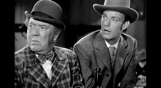 Guy Kibbee as Francis 'Eight Ball' Harrigan and Dennis O'Keefe as Jeff Burton get their first glimpse of Loretta Douglas in The Bad Man of Brimstone (1937)