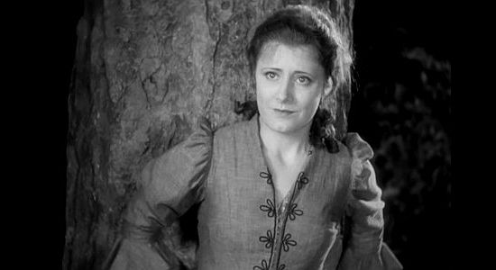 Irene Dunne as Sabra Cravet, frightened with bandits charge into her family's camp in Cimarron (1931)
