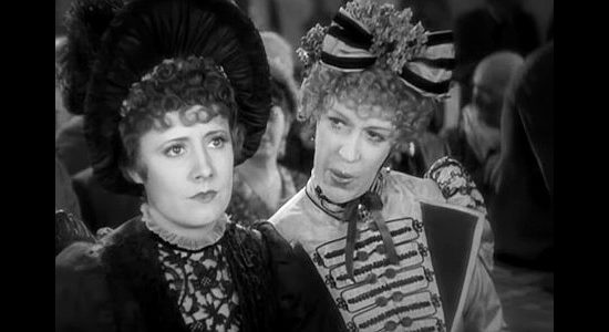 Irene Dunne as Sabra Cravet meeting socialite Tracy Wyatt (Edna May Oliver) at a church service in Cimarron (1931)