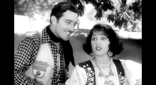 John Boles as Capt. Jim Stewart and Bebe Daniels as Rita Ferguson during a musical interlude in Rio Rita (1929)