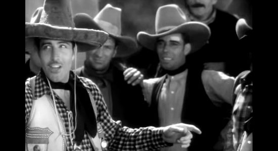 John Boles as Capt. Jim Stewart with his fellow Texas Rangers in Rio Rita (1929)
