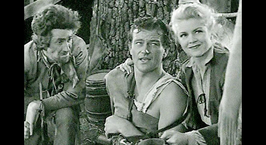 John C. Hamilton as Professor, John Wayne as a wounded Jim Smith and Claire Trevor as Janie MacDougall in Allegheny Uprising (1939)