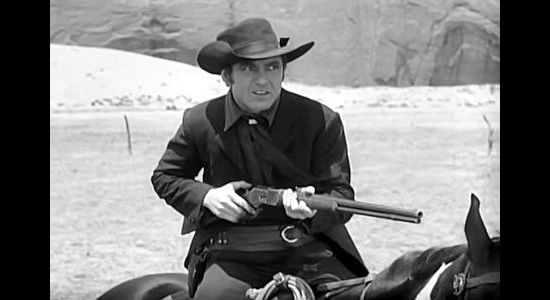 Johnny Mack Brown as Billy, ready for a mounted showdown with Bob Ballinger in Billy the Kid (1930)