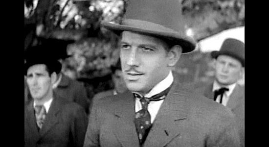 Melvyn Douglas as Jeff Hogarth, Buffalo Bill's business partner and the man who discovers Annie in Annie Oakley (1935)
