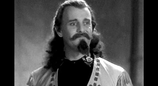 Moroni Olsen as Buffalo Bill Cody, meeting Annie for the first time in Annie Oakley (1935)