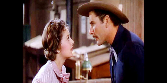 Olivia de Havilland as Abbie Irving and Errol Flynn as Wade Hatton, butting heads again in Dodge City (1939)