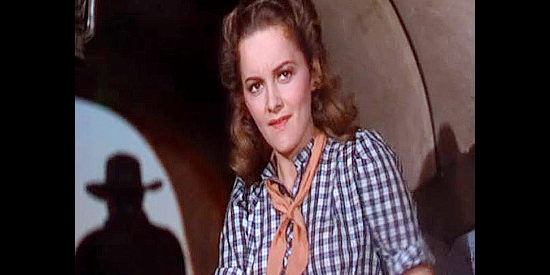Olvia de Havilland as Abbie Irving, iritated with wagon train boss Wade Hatton in Dodge City (1939)