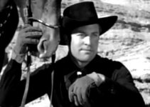 Chester Morris as Bob Sangster, ready to rob the sanctimonious town in which he grew up in Three Godfathers (1936)