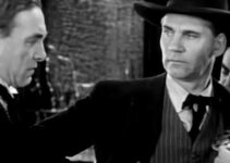 Harry Carey as Ed Brandt, learning the Frame Johnson (Walter Huston) has pinned on another badge in Law and Order (1932)