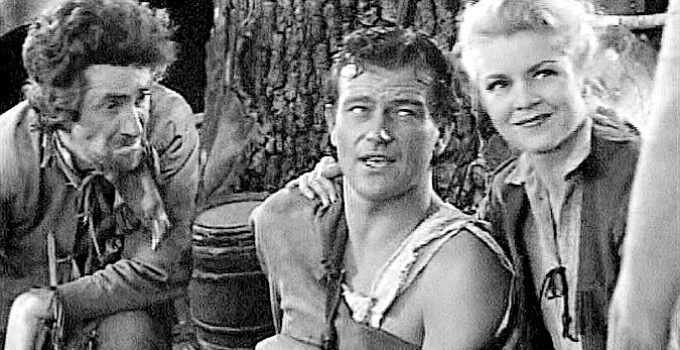 John C. Hamilton as Professor, John Wayne as a wounded Jim Smith and Claire Trevor as Janie MacDougall in Allegheny Uprising (1939)