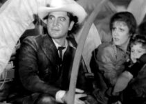 Richard Dix as Yancey Cravet, Irene Dunne as Sabra and their young son Cim arriving in Osage in Cimarron (1931)