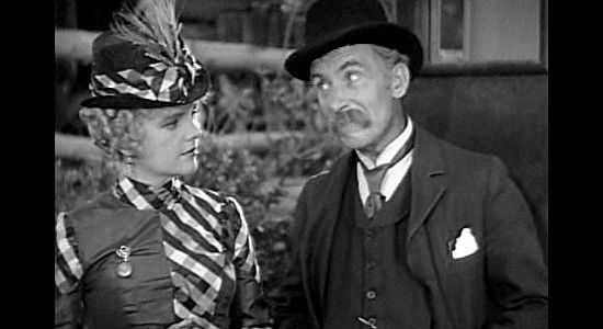 Pert Kelton as Vera Delmar, a woman in love with Toby Walker, with MacIovor (Andy Clyde), the man who sets up Annie's shooting match against Toby in Annie Oakley (1935)