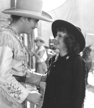 Preston Foster as Toby Walker and Barbara Stanwyck as Annie Oakley in Annie Oakley (1935)
