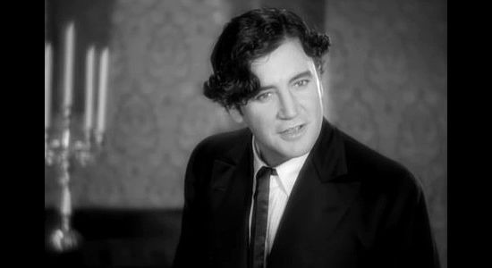 Richard Dix as Yancey Cravet, announcing plans to move his family West in Cimarron (1931)