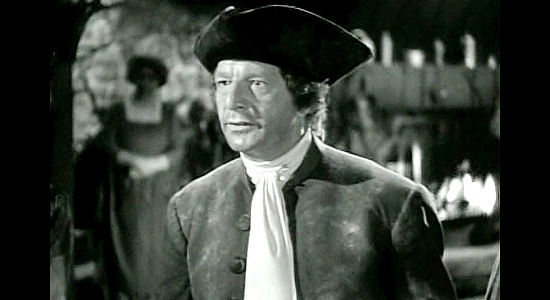 Robert Barrat as Duncan, the valley magistrate, trying to keep hostilities from breaking out in Allegheny Uprising (1939)