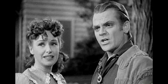 Rosemary Lane as Jane Hardwick and James Cagney as The Oklahoma Kid, disagreeing again in The Oklahoma Kid (1939)