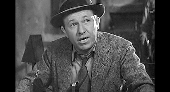 Stuart Erwin as Johnny Sykes, the newspaperman who reports -- and sometimes embellishes-- Pancho's exploits in Viva Villa! (1934)