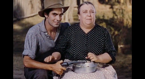 Tyrone Power as Jesse James and Jane Darnell as Mrs. Samuels when the railroad land agents show up in Jesse James (1939)