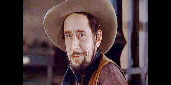 Victor Jory as Yancy, Jeff Surrent's fast gun, about to be jailed in Dodge City (1939)