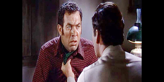 Ward Bond as Bud Taylor, a Surrett man being grilled by Wade Hatton in Dodge City (1939)