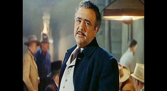 Akim Tamiroff as Joe Faringo, the man who expects Nick Buckley to lead him to a fortune in gold in Relentless (1948)