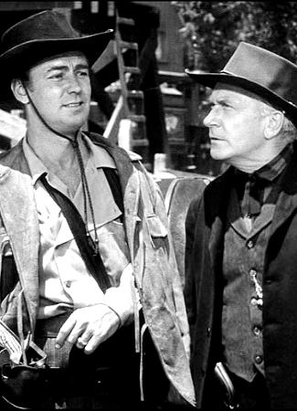 Alan Ladd as Luke Smith and William Demarest as Bill Lansing in Whispering Smith (1948)