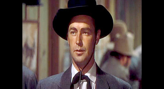 Alan Ladd as Whispering Smith, a man trying to get to the bottom of a string of railroad accidents in Whispering Smith (1948)