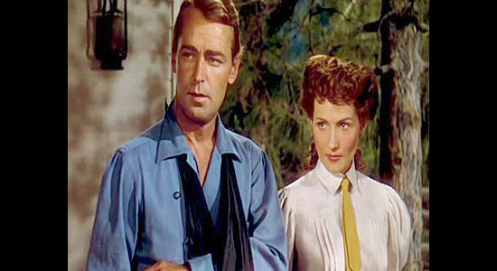 Alan Ladd as Whispering Smith and Brenda Marshall as Marian Sinclair, wondering about her husband's changed attitude in Whispering Smith (1948)