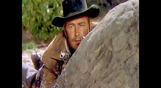 Alan Ladd as Whispering Smith, trying to figure out who tried to ambush him in Whispering Smith (1948)