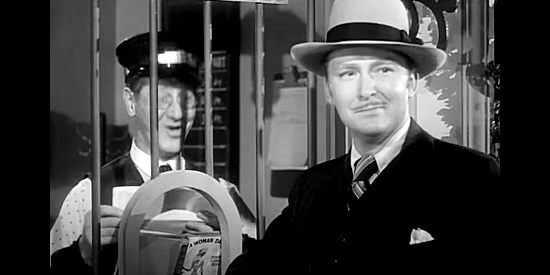 Albert Dekker as Jim Gardner, laying eyes on Catherine Allen for the first time in War of the Wildcats (1943)