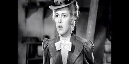 Audrey Long as Clara Cardell, reacting to a shock in Tall in the Saddle (1944)