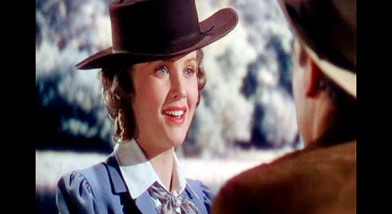 Barbara Britton as Molly Wood, learning to enjoy spending time with the Virginian in The Virginian (1946)