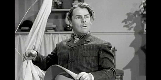 Brian Donlevy as Grat Dalton, untangling himself from a photography mishap in When the Daltons Rode (1940)