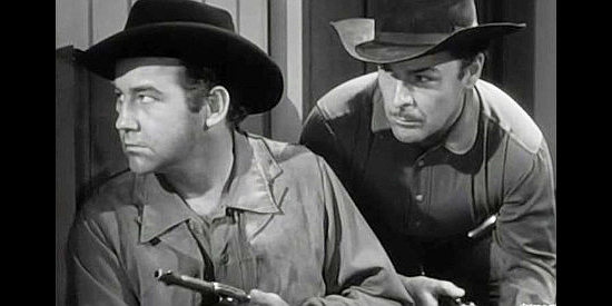 Broderick Crawford as Bob Dalton and Brian Donlevy as Grat, ready to face a mob in When the Daltons Rode (1940) 