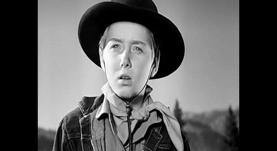 Claude Jarman Jr. as Steve Phillips, realizing his older brother Clay is in danger in Roughshod (1949)