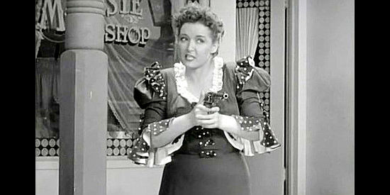 Dorothy Granger as Nancy, ready to gun down Ozark in a fit of jealousy in When the Daltons Rode (1940)