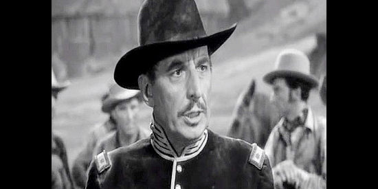 Douglas Dumbrille as Maj. Drewery, the Union officer out to recover the Confederate gold in Virginia City (1940)