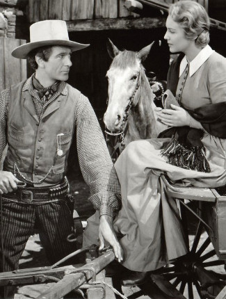 Dusty Rivers as Gary Cooper with Madeleine Carroll as April Logan in North West Mounted Police (1940)