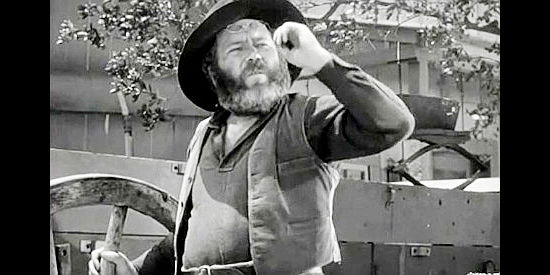 Edgar Buchanan as the blacksmith who welcomes Tod Jackson when he arrives in town in When the Daltons Rode (1940)