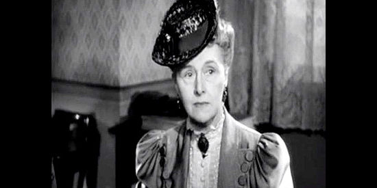 Elisabeth Risdon as Miss Elizabeth Martin, meddling in Clara Cardell's affairs in Tall in the Saddle (1944)