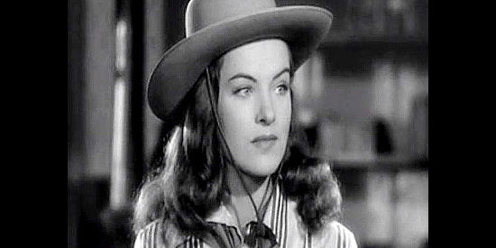 Ella Raines as Arly Harolday, the tomboyish young woman who runs the Harolday spread in Tall in the Saddle (1944)