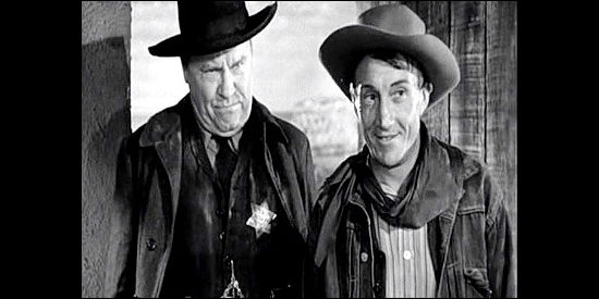 Emory Parnell as Sheriff Jackson and Paul Fix as Bob Clews, up to no good in Tall in the Saddle (1944)