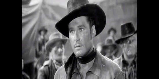 Errol Flynn as Kerry Bradford, the Union officer out to stop gold from reaching the Confederacy in Virginia City (1940)