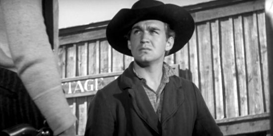 Forrest Tucker as Wade Harper, ready to wage war against the cattlemen on the homesteaders' behalf in The Westerner (1940)