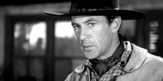 Gary Cooper as Cole Harden, trying to find out who burned out the homesteaders in The Westerner (1940)