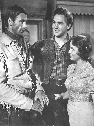 Gary Cooper as Cole Harden with Forrest Tucker as Wade Harper and Doris Davenport as Jane Mathews in The Westerner (1940)