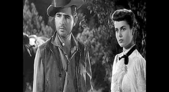 George Cooper as Clayton, the cowboy who chases down Marcia with a marraige proposal in Roughshod (1949)