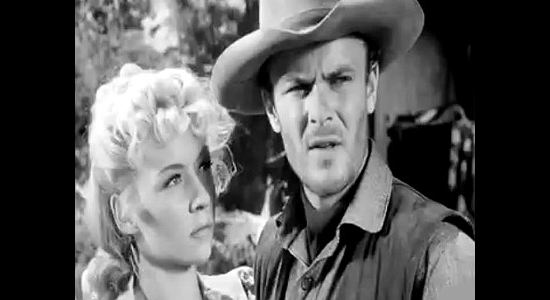 Gloria Grahame as Mary Wells and Robert Sterling as Clay Phillips, caught kissing in Roughshod (1949)