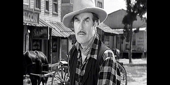 Harry Woods as George Clews, fresh out of prison and ready for a showdown in Tall in the Saddle (1944)